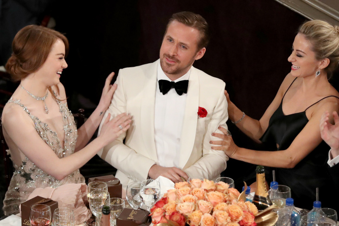 BEVERLY HILLS, CA - JANUARY 08: EXCLUSIVE ACCESS - PREMIUM RATES APPLY. FACEBOOK OUT. 74th ANNUAL GOLDEN GLOBE AWARDS -- Pictured: (l-r) Actress Emma Stone, actor Ryan Gosling and actress Olivia Hamilton at the 74th Annual Golden Globe Awards held at the Beverly Hilton Hotel on January 8, 2017. (Photo by Richard Heathcote/NBC/NBCU Photo Bank)